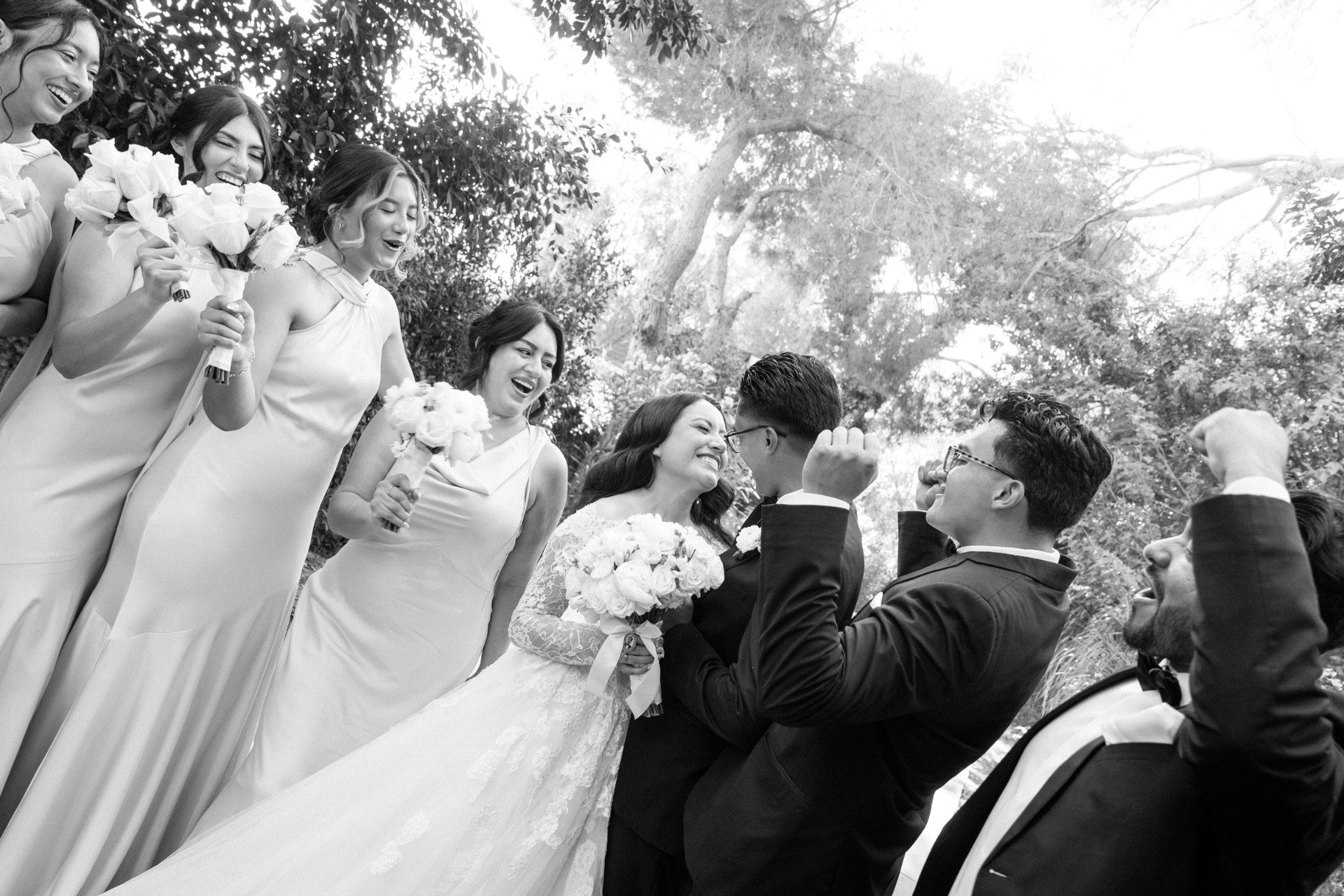 Black-and-white celebration with the couple and their wedding party.